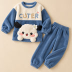 Pyjama pilou pilou femme et ado animal bleu à fleur deux pièces posé à plat sur fond beige, sans personne
