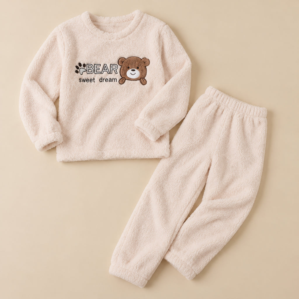 Ensemble pyjama deux pièces Pyjama chaud fille et femme ours écru douillet posé à plat sur fond beige, sans personne