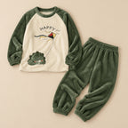 Ensemble pyjama deux pièces Ensemble pyjama femme et ado dinosaure au cerf-volant posé à plat sur fond beige, sans personne
