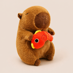 Peluche Capybara avec un Poisson